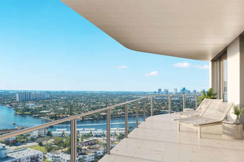 Wide private terrace with chaise loungers and Intracoastal skyline views at Four Seasons Residences Fort Lauderdale in Fort Lauderdale, showcasing luxury and ultra luxury condos with elevated outdoor living above the waterway.