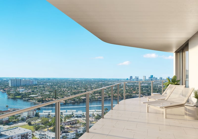 Wide private terrace with chaise loungers and Intracoastal skyline views at Four Seasons Residences Fort Lauderdale in Fort Lauderdale, showcasing luxury and ultra luxury condos with elevated outdoor living above the waterway.