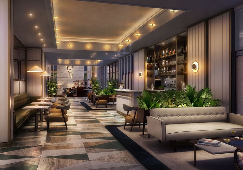 Evening view of the lobby coffee bar lounge with intimate lighting and café seating at Four Seasons Residences Fort Lauderdale in Fort Lauderdale, presenting luxury and ultra luxury condos with inviting social amenity space.