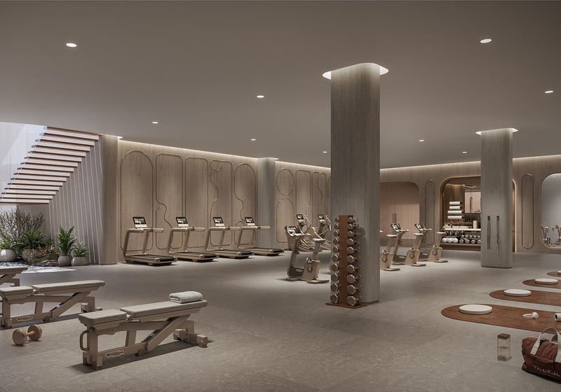 Fitness studio at Frida Kahlo Residences in Wynwood, designed for luxury and ultra luxury condos living with treadmills, bikes, strength benches, and an open area for stretching and yoga.