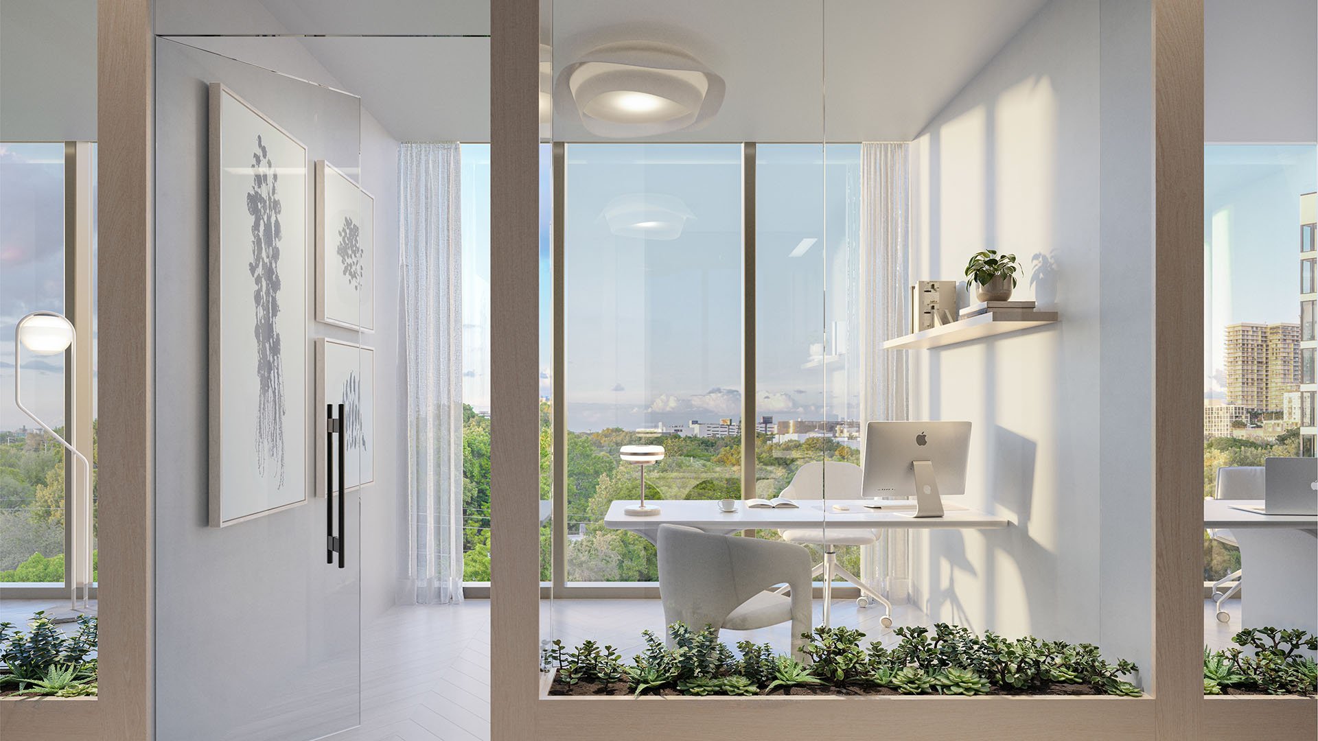 Glass-walled office at Frida Kahlo Residences in Wynwood, reflecting luxury and ultra luxury condos living with a minimalist desk, floor-to-ceiling windows, and a bright tree-lined view.