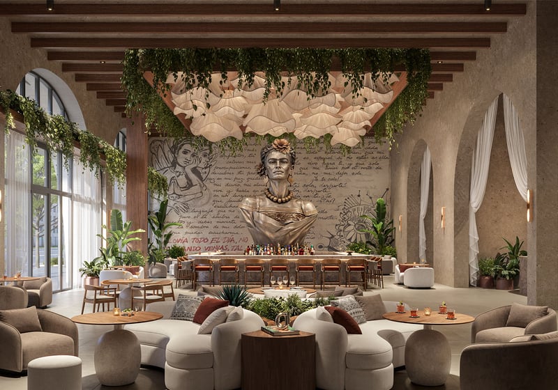 Lobby lounge at Frida Kahlo Residences in Wynwood, presenting luxury and ultra luxury condos amenities with a dramatic Frida Kahlo bust, bar seating, hanging greenery, and sculptural lighting.