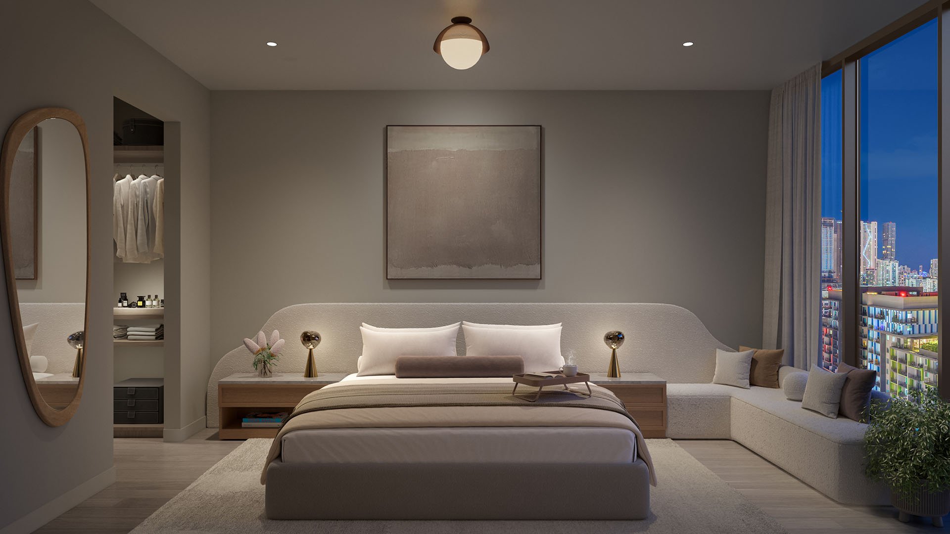 Primary bedroom at Frida Kahlo Residences in Wynwood, tailored for luxury and ultra luxury condos with an upholstered bed, open closet, built-in window seat, and skyline views at dusk.