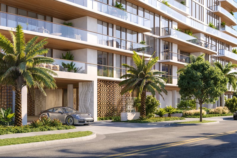 Glass House Boca Raton street-level porte cochere and palm-lined entrance, showcasing luxury and ultra luxury preconstruction condos arrival experience in Boca Raton, Florida.