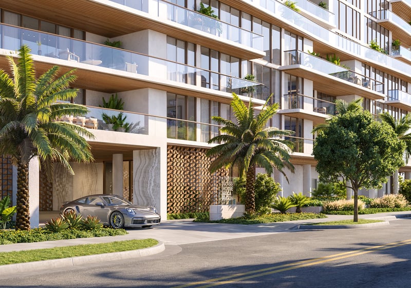 Glass House Boca Raton street-level porte cochere and palm-lined entrance, showcasing luxury and ultra luxury preconstruction condos arrival experience in Boca Raton, Florida.