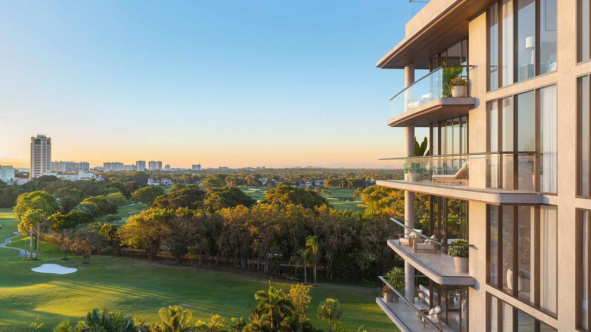 Glass House Boca Raton balcony view over golf course and green space at sunset, highlighting luxury and ultra luxury preconstruction condos lifestyle in Boca Raton, Florida.