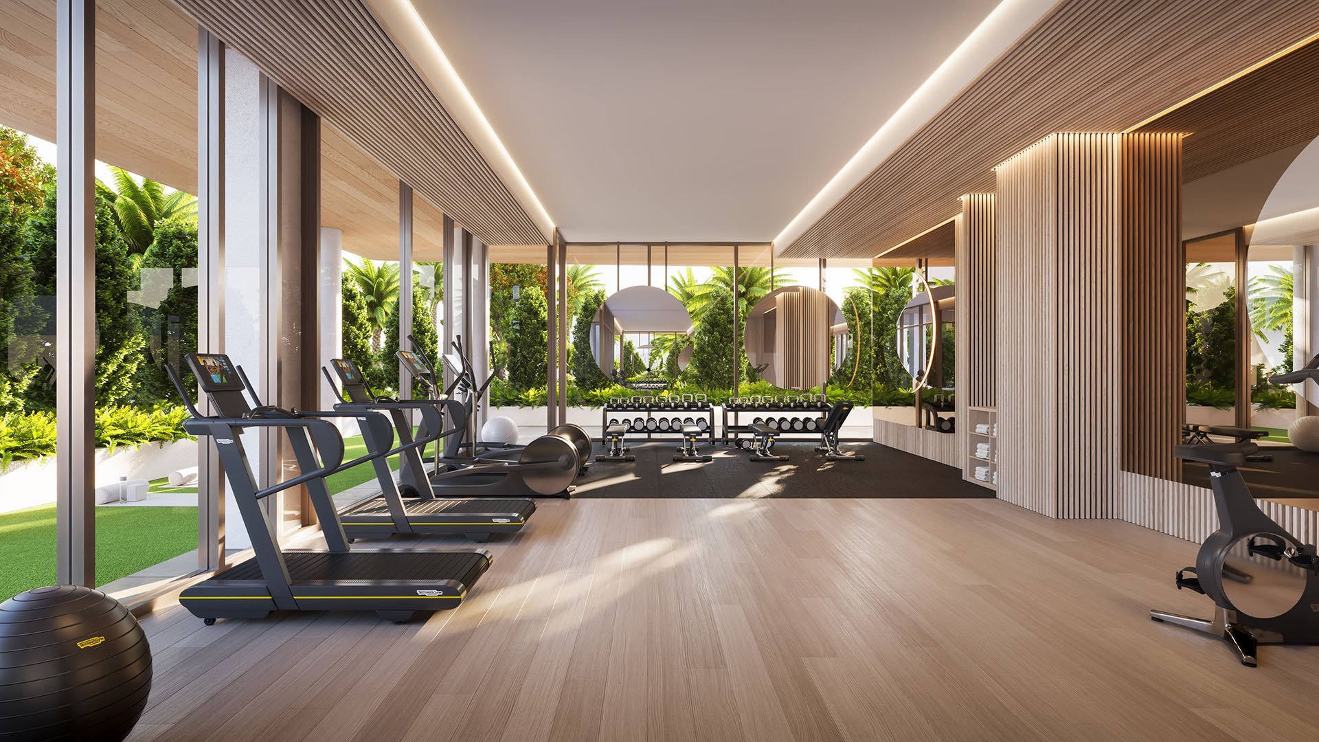 Glass House Boca Raton modern fitness center with treadmills and free weights, floor-to-ceiling windows to tropical gardens, featuring luxury and ultra luxury preconstruction condos amenities in Boca Raton, Florida.