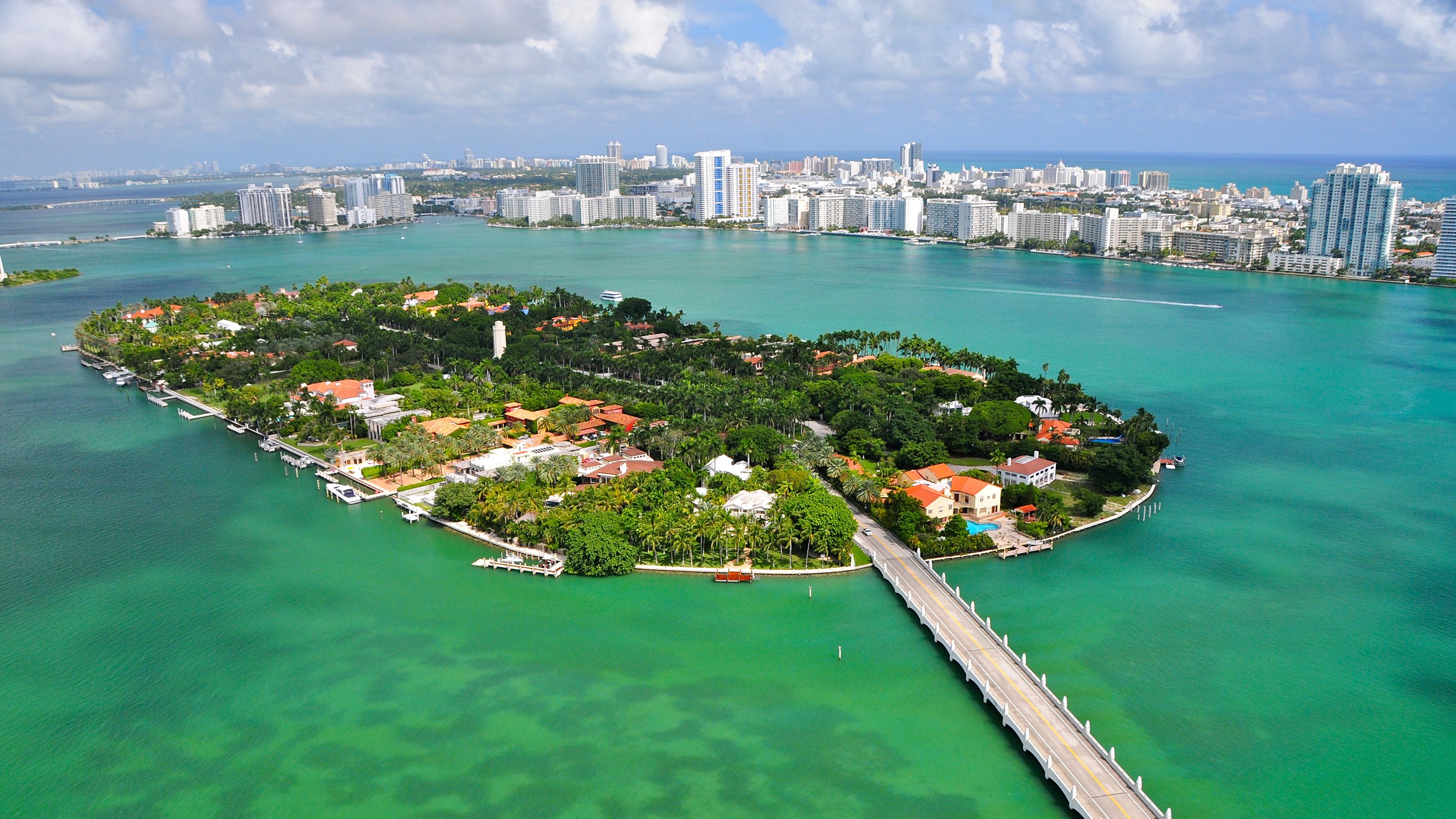 Hibiscus, Star and Palm Islands, Miami aerial over Biscayne Bay—private islands lined with estates and nearby luxury and ultra luxury condos; renowned resale market.
