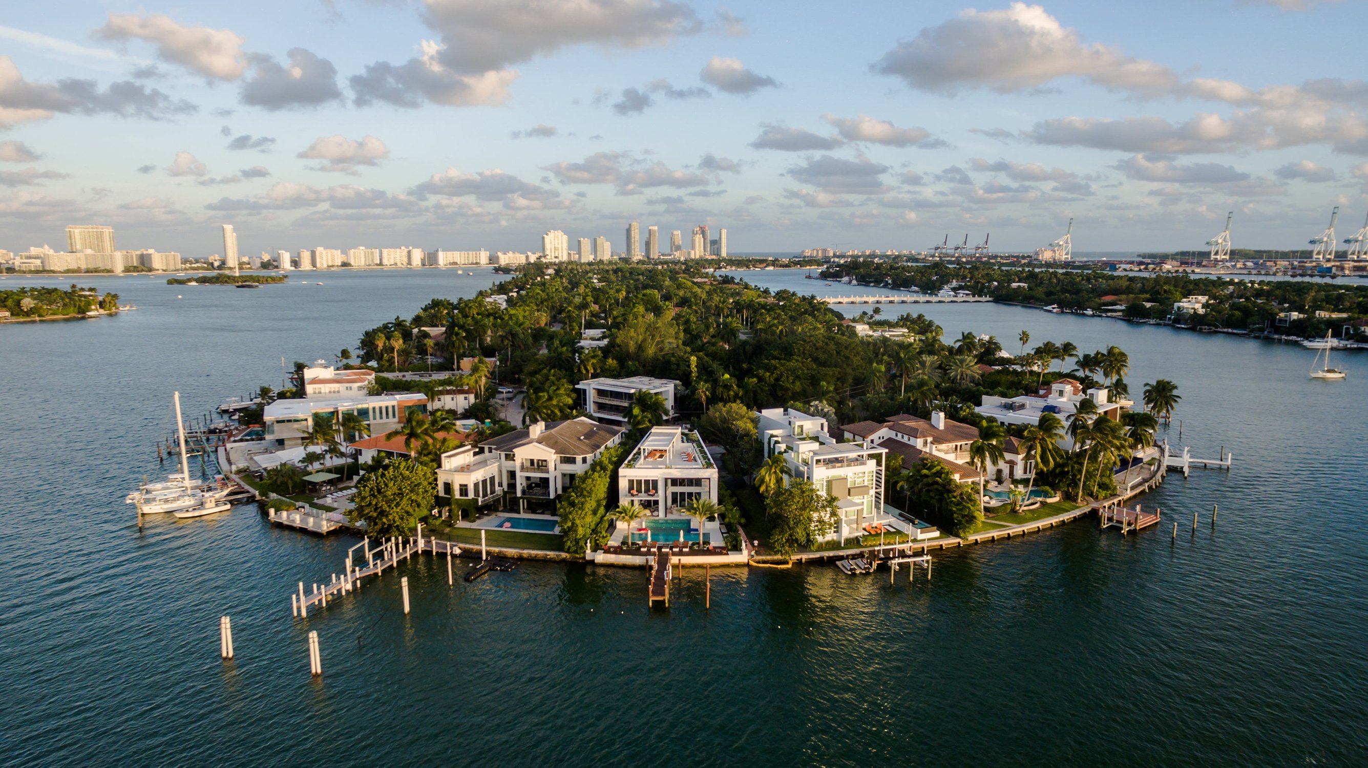 Hibiscus, Star or Palm Islands waterfront homes on Biscayne Bay in Miami—guard‑gated enclave near luxury and ultra luxury condos; premium resale market.
