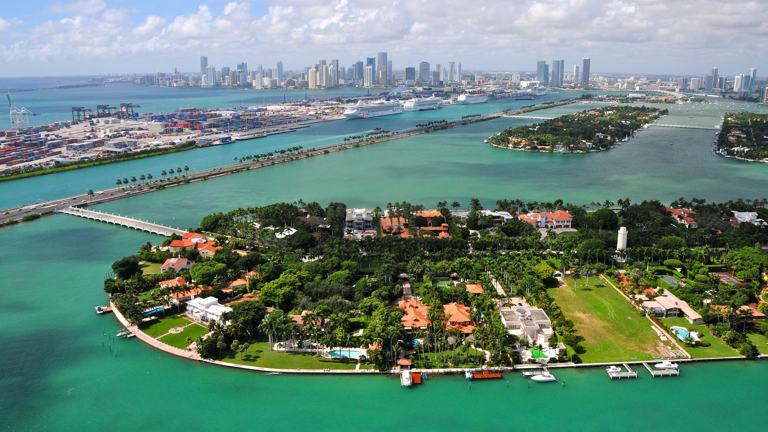 Hibiscus. Star. Palm Islands aerial with Miami skyline, yachts, causeways and bay; elite enclave near luxury and ultra luxury condos; resale demand. Featuring view, waterfront, and homes.