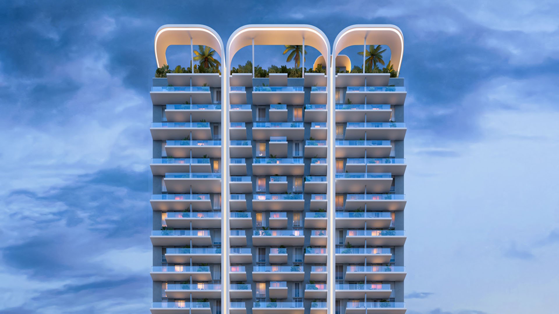 Blue-hour tower crown elevation at House of Wellness in Brickell preconstruction luxury and ultra luxury condos with curved rooftop arches, planted terraces, and illuminated balconies.