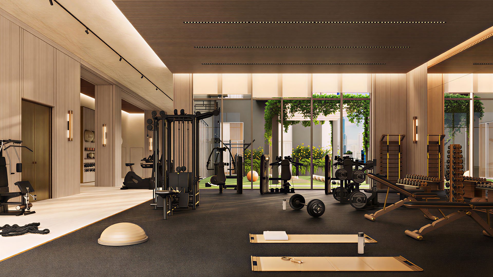Fitness center at House of Wellness in Brickell preconstruction luxury and ultra luxury condos with strength machines, free weights, mats, and floor-to-ceiling windows.
