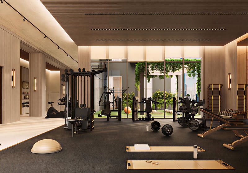 Fitness center at House of Wellness in Brickell preconstruction luxury and ultra luxury condos with strength machines, free weights, mats, and floor-to-ceiling windows.