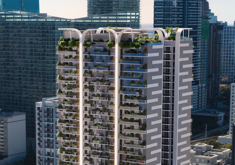 Oblique exterior view of House of Wellness in Brickell preconstruction luxury and ultra luxury condos showing planted balconies, the rooftop crown, and nearby waterfront towers.