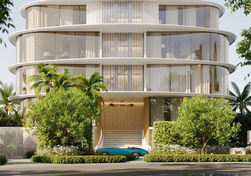 Indian Creek Residences and Yacht Club arrival entrance and porte cochere with lush landscaping and curved glass facade, Bay Harbor Islands, Miami area, Florida, luxury and ultra luxury preconstruction condos waterfront address.