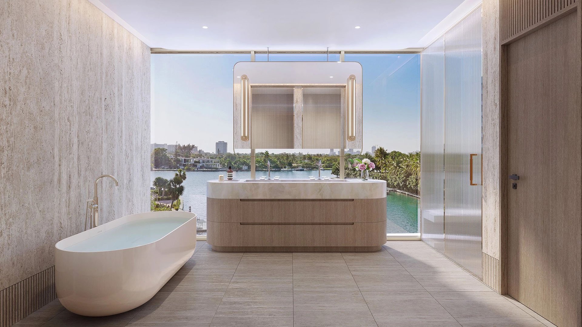 Indian Creek Residences and Yacht Club spa primary bathroom with freestanding tub, double vanity and expansive waterfront view, Bay Harbor Islands, Miami area, Florida, luxury and ultra luxury preconstruction condos interiors.