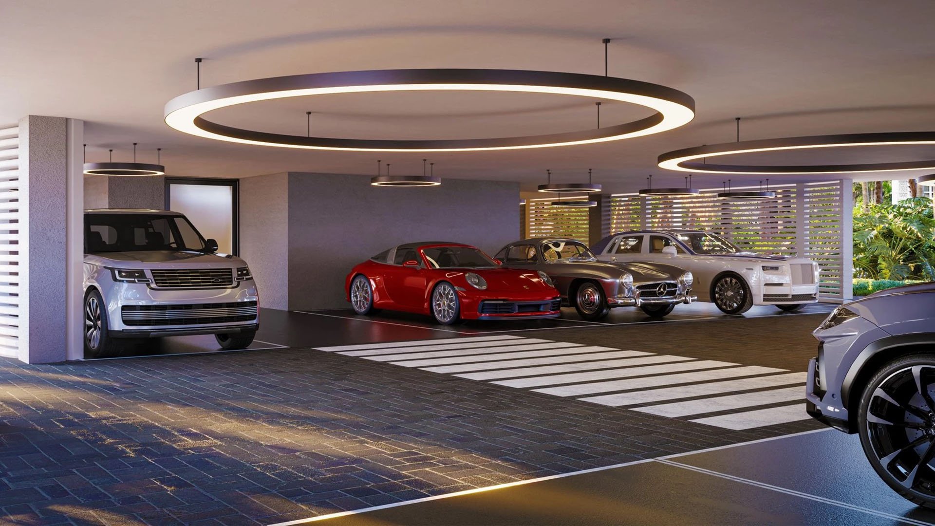 Indian Creek Residences and Yacht Club private residents garage with luxury car collection parking and modern ring lighting, Bay Harbor Islands, Miami area, Florida, luxury and ultra luxury preconstruction condos services.