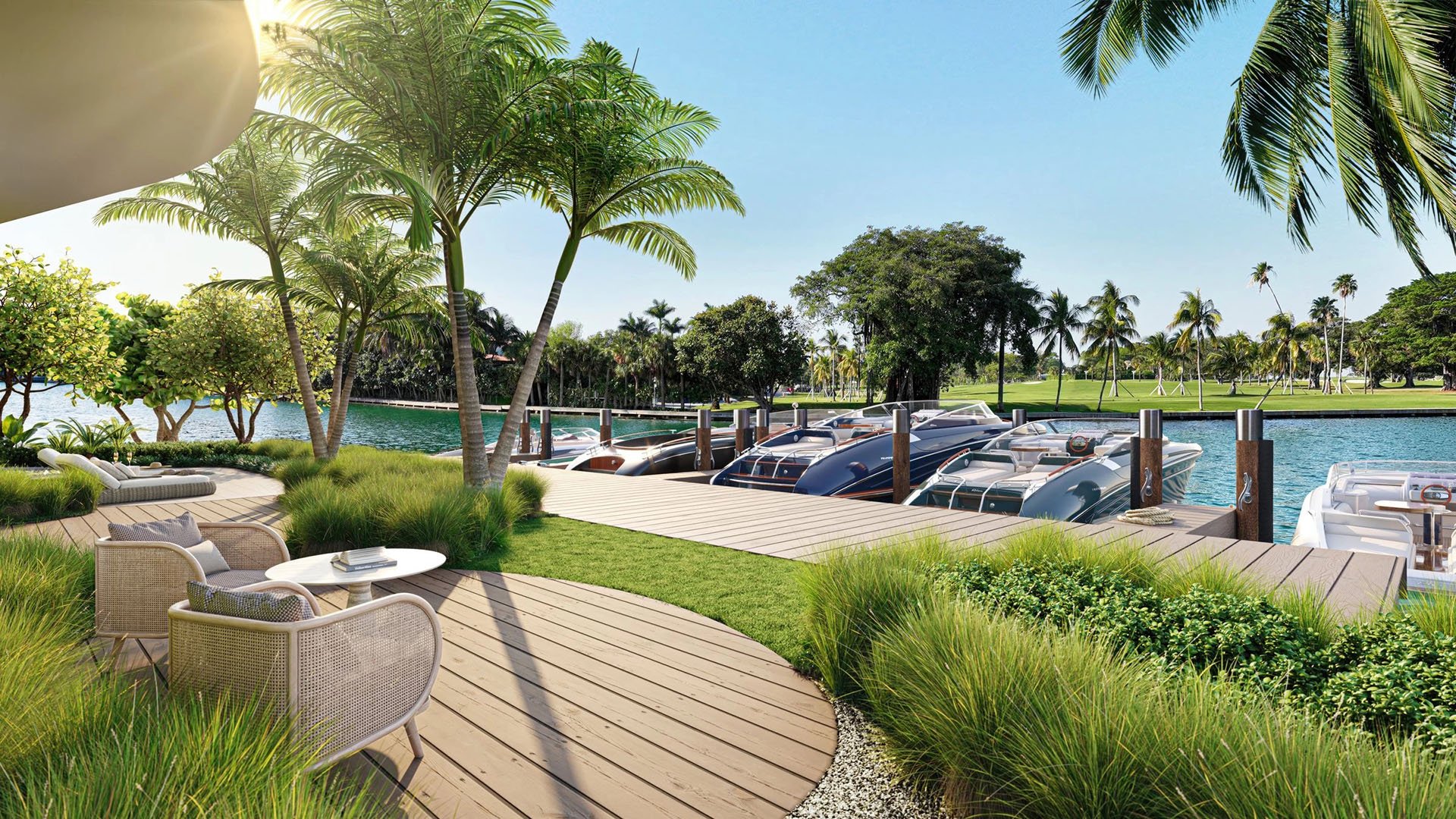 Indian Creek Residences and Yacht Club Bay Harbor Islands, Miami, Florida waterfront lounge deck beside yacht slips, palms and waterway views toward the golf course, an amenity for luxury and ultra luxury preconstruction condos.