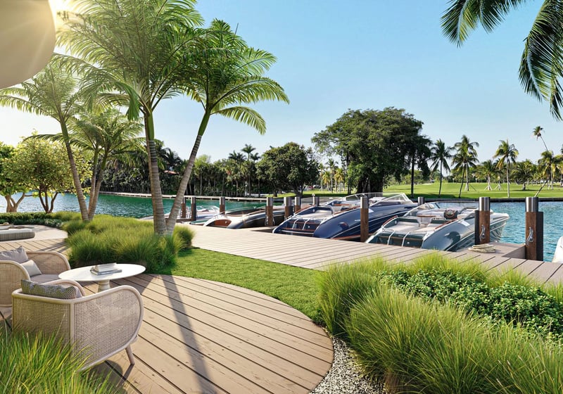 Indian Creek Residences and Yacht Club Bay Harbor Islands, Miami, Florida waterfront lounge deck beside yacht slips, palms and waterway views toward the golf course, an amenity for luxury and ultra luxury preconstruction condos.