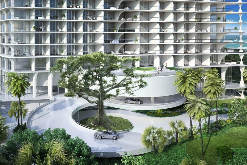 Jade Signature in Sunny Isles Beach luxury and ultra luxury condos entrance view with a curved porte cochere, sweeping driveway, tropical landscaping and the sculpted tower facade.