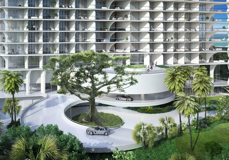 Jade Signature in Sunny Isles Beach luxury and ultra luxury condos entrance view with a curved porte cochere, sweeping driveway, tropical landscaping and the sculpted tower facade.