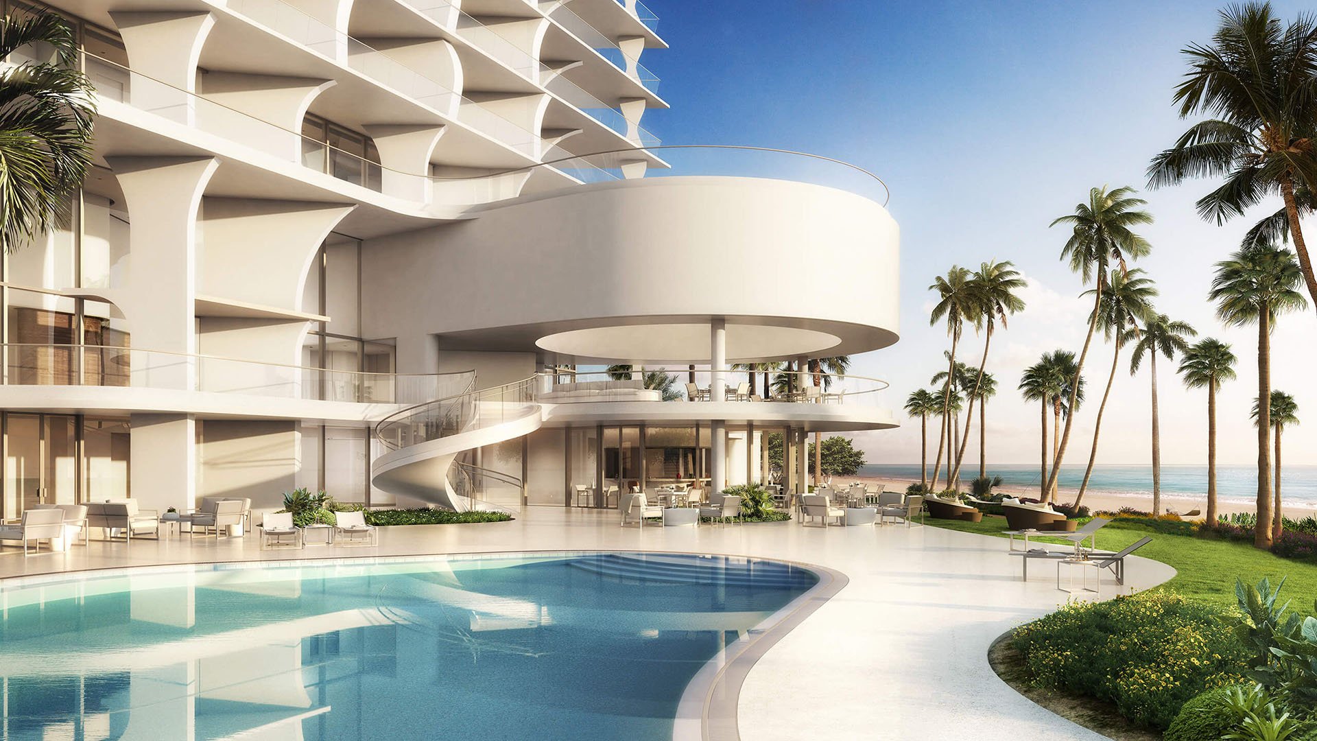 Jade Signature in Sunny Isles Beach luxury and ultra luxury condos resort pool deck with a circular pavilion, curved columns, palm trees, loungers and a beachfront setting.