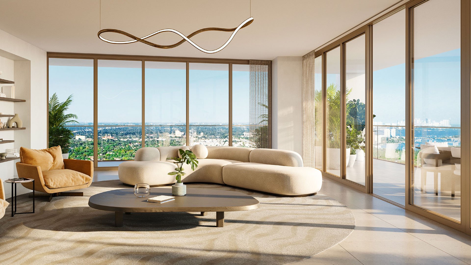 Jean-Georges Miami Tropic Residences living room with sculptural curved sofa, wavy chandelier and floor-to-ceiling windows, Miami, Florida, showcasing luxury and ultra luxury preconstruction condos with panoramic city and bay views.