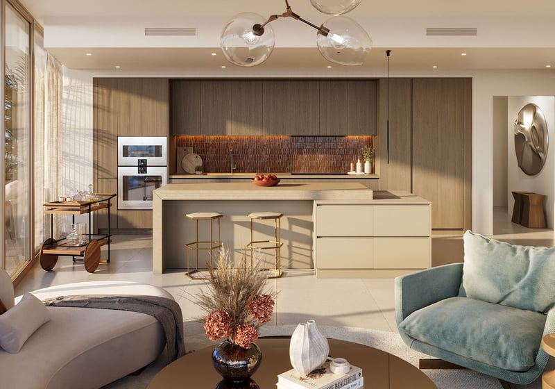 Jean-Georges Miami Tropic Residences gourmet kitchen with oversized island, designer backsplash and built-in appliances, Miami, Florida, featuring luxury and ultra luxury preconstruction condos with open-plan entertaining and curated lighting.