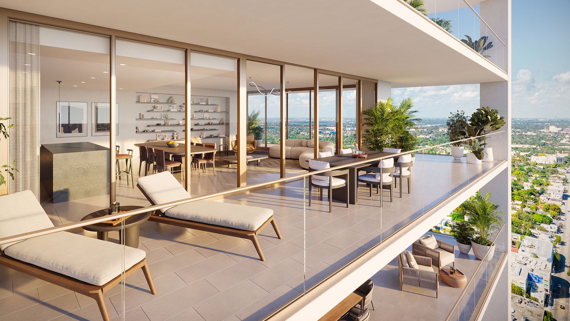 Wraparound balcony at Jean-Georges Miami Tropic Residences in Miami, Florida, with outdoor dining, lounge chairs and expansive city views, highlighting luxury and ultra luxury preconstruction condos with indoor-outdoor living.