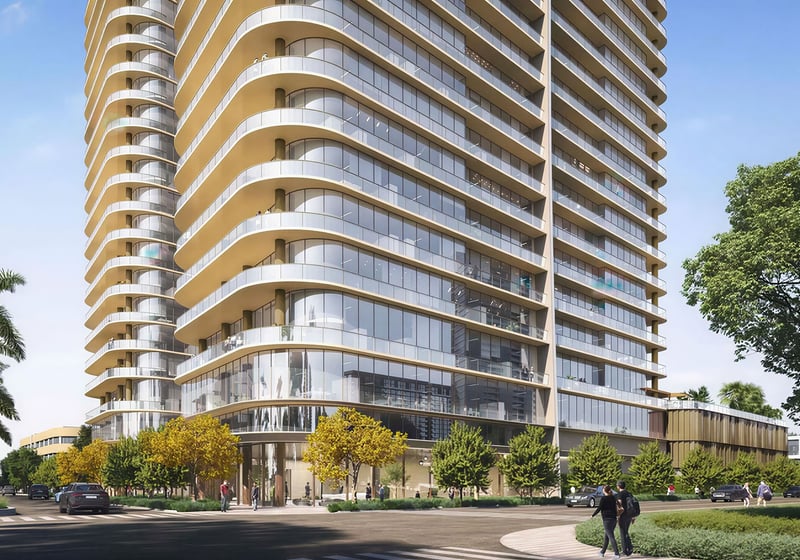 Kempinski Residences Miami in Miami Design District, luxury and ultra luxury condos, preconstruction street-corner exterior highlighting curved glass facades, wraparound balconies, double-height lobby glazing, and landscaped sidewalks.