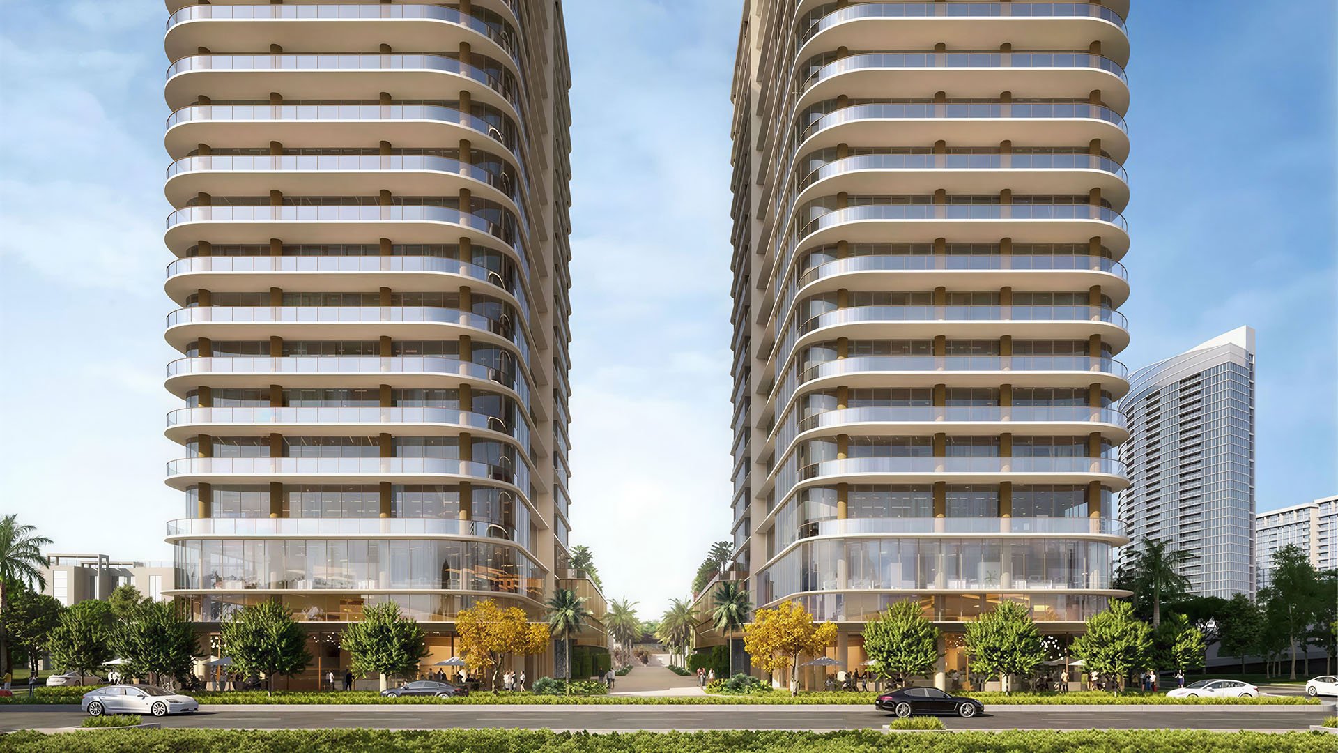 Kempinski Residences Miami in Miami Design District, luxury and ultra luxury condos, preconstruction streetfront view of twin towers with rounded balconies, transparent podium levels, and a central palm-lined paseo between the buildings.