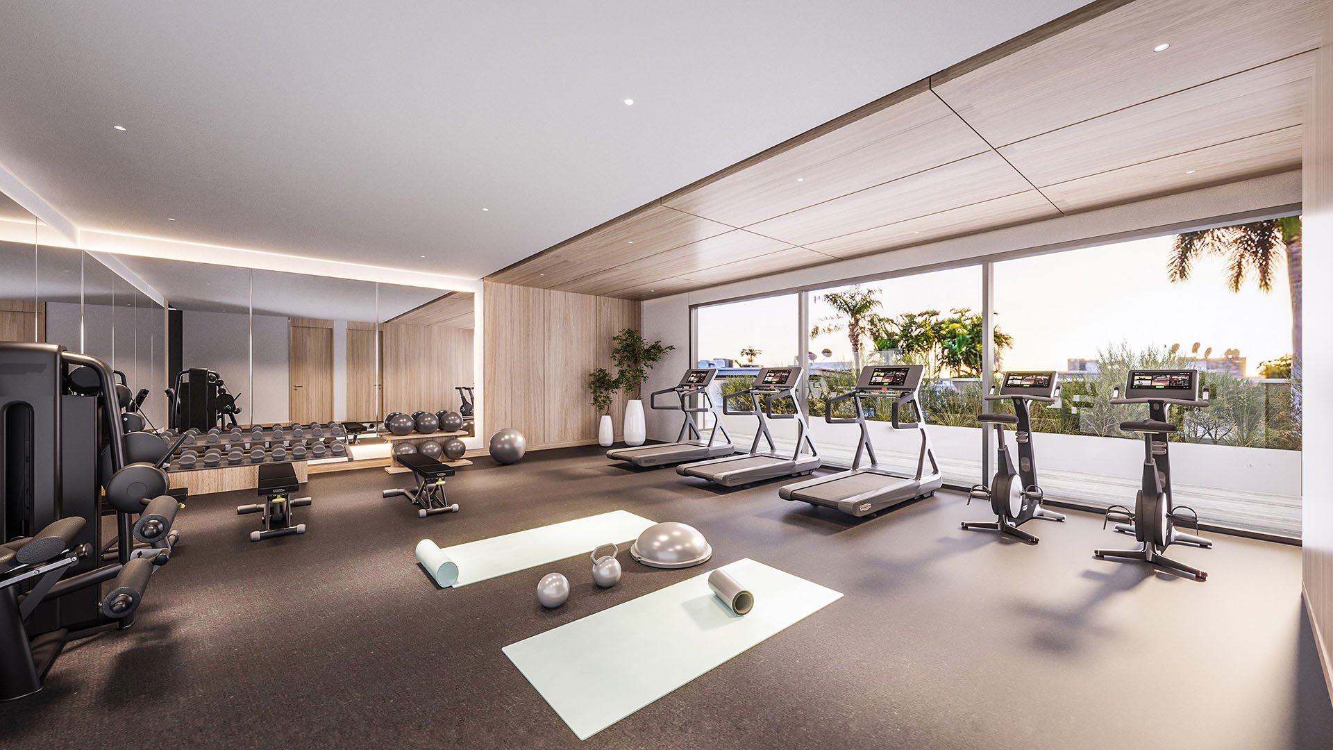 La Baia North Bay Harbor Islands, Miami, Florida fitness center with treadmills, free weights and yoga space by floor-to-ceiling windows, part of luxury and ultra luxury preconstruction condos amenities.