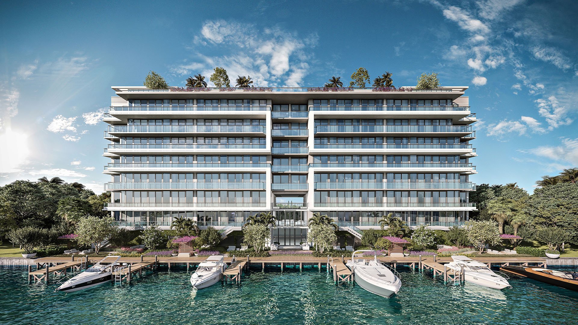 La Baia North Bay Harbor Islands, Miami, Florida waterfront view with yacht docks, landscaped promenade and Biscayne Bay backdrop, showcasing luxury and ultra luxury preconstruction condos.