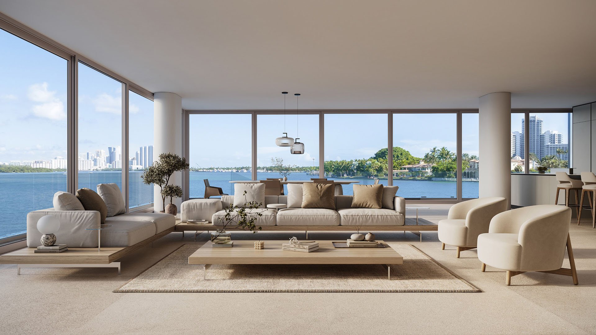 La Mare Bay Tower open-plan living room in Bay Harbor Islands, Miami, Florida, featuring panoramic windows, lounge seating and waterfront view, showcasing luxury and ultra luxury preconstruction condos.