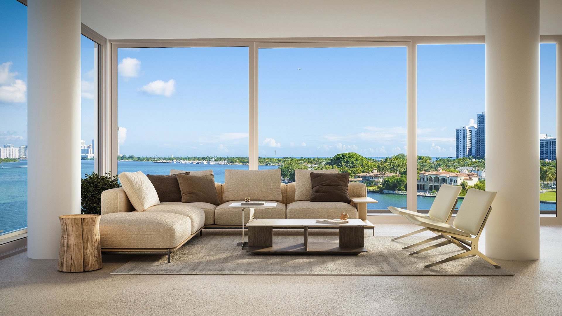 La Mare Bay Tower living room in Bay Harbor Islands, Miami, Florida, with sectional sofa, floor-to-ceiling windows and bay views, representing luxury and ultra luxury preconstruction condos lifestyle.