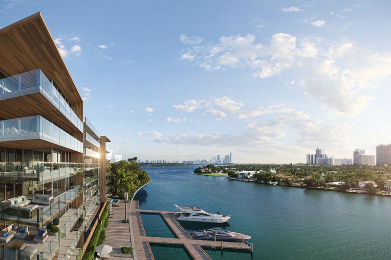 La Mare Regency Tower waterfront balconies in Bay Harbor Islands, Miami, Florida, overlooking marina yacht docks at sunset, showcasing luxury and ultra luxury preconstruction condos on the bay.