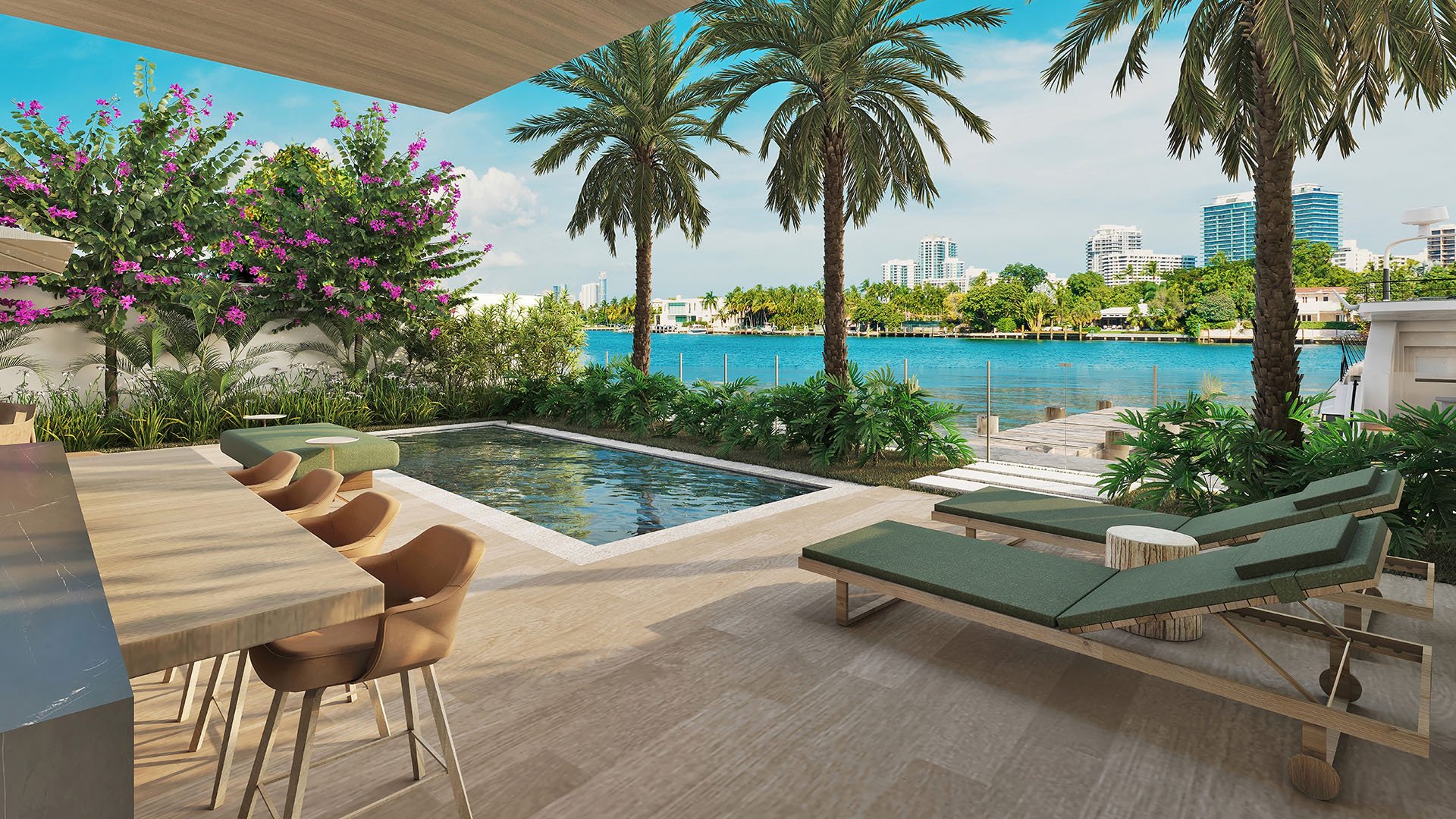 Waterfront deck with pool, sun loungers and palm trees overlooking the Intracoastal Waterway at La Mare Regency Tower, Bay Harbor Islands, Miami, Florida, representing luxury and ultra luxury preconstruction condos outdoor living.