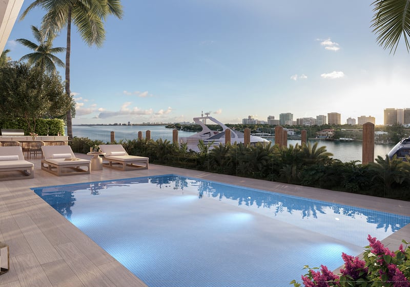 Sunset waterfront pool deck with yachts and Biscayne Bay views at La Mare Signature Tower bay villa, Bay Harbor Islands, Miami, Florida, showcasing luxury and ultra luxury preconstruction condos amenities.