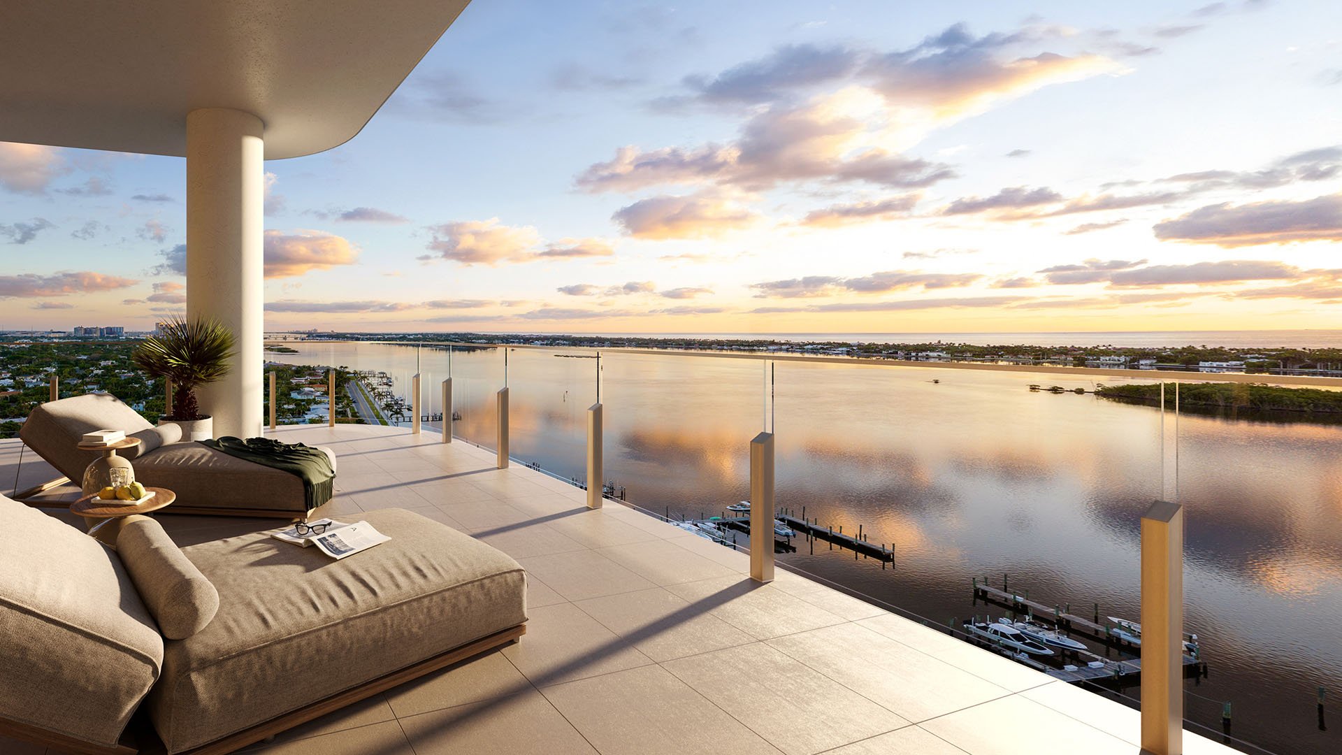 Covered sky terrace with chaise lounges, glass railing and sweeping waterfront view at Maison D'Or in West Palm Beach, showcasing luxury and ultra luxury preconstruction condos with elevated outdoor living.