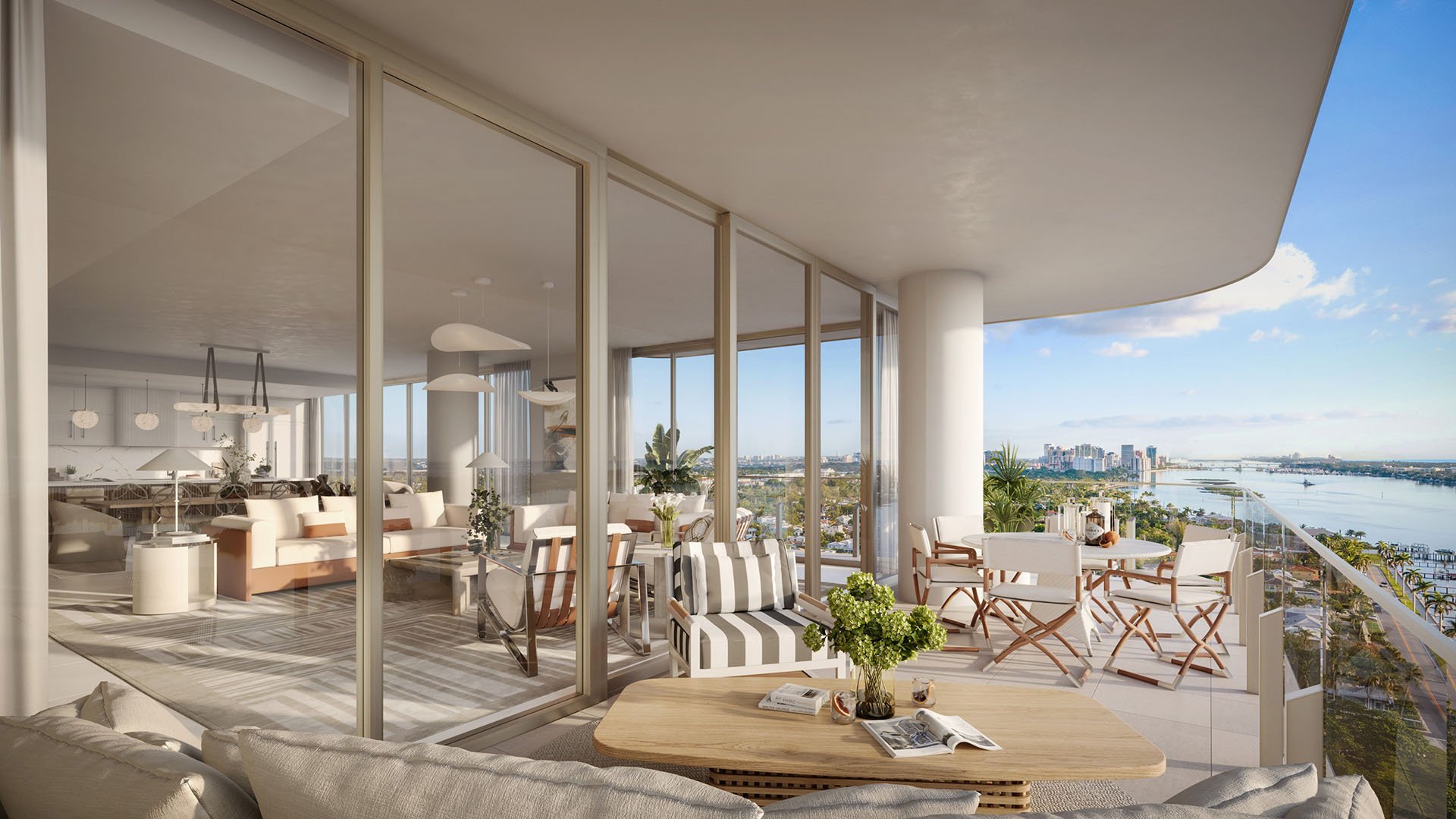 Glass-walled great room opening to a furnished waterfront terrace at Maison D'Or in West Palm Beach, showcasing luxury and ultra luxury preconstruction condos with seamless indoor-outdoor living.