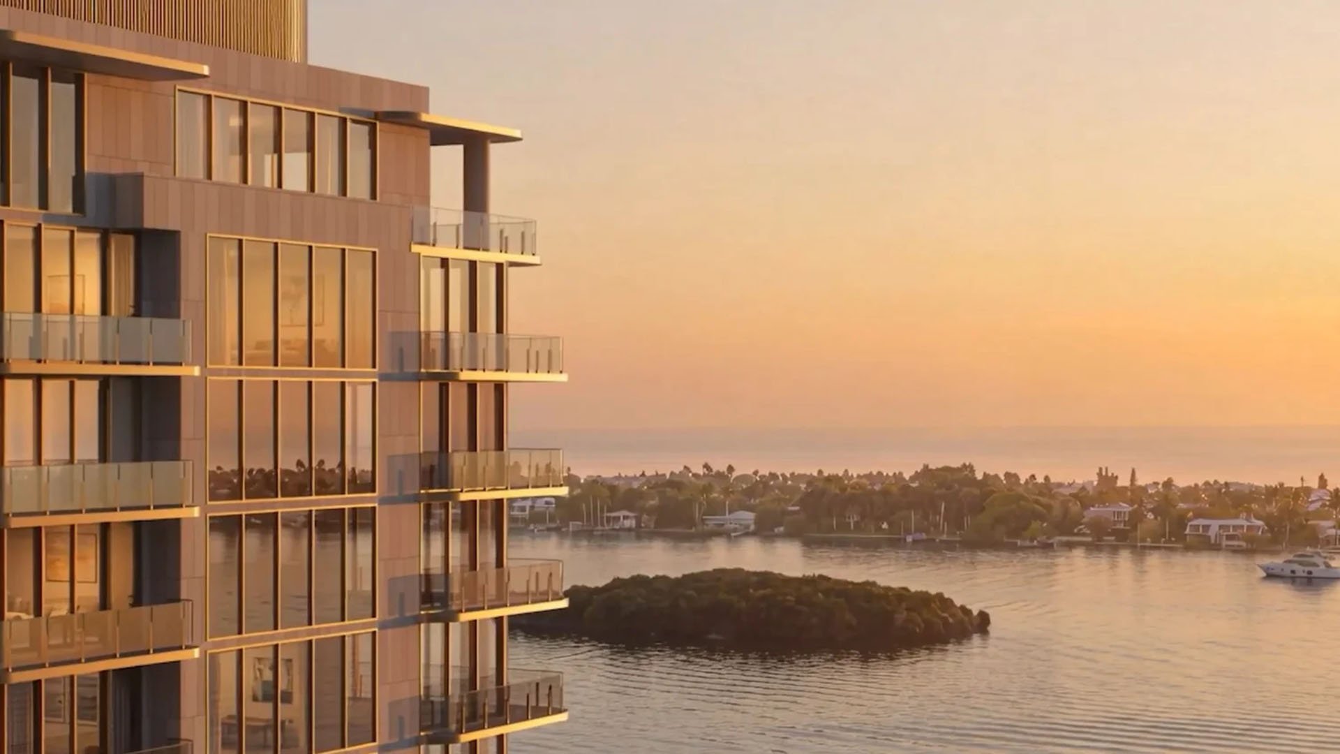 Golden-hour exterior view beside a small waterfront island at Maison D'Or in West Palm Beach, showcasing luxury and ultra luxury preconstruction condos with glass balconies and warm sunset-toned reflections.