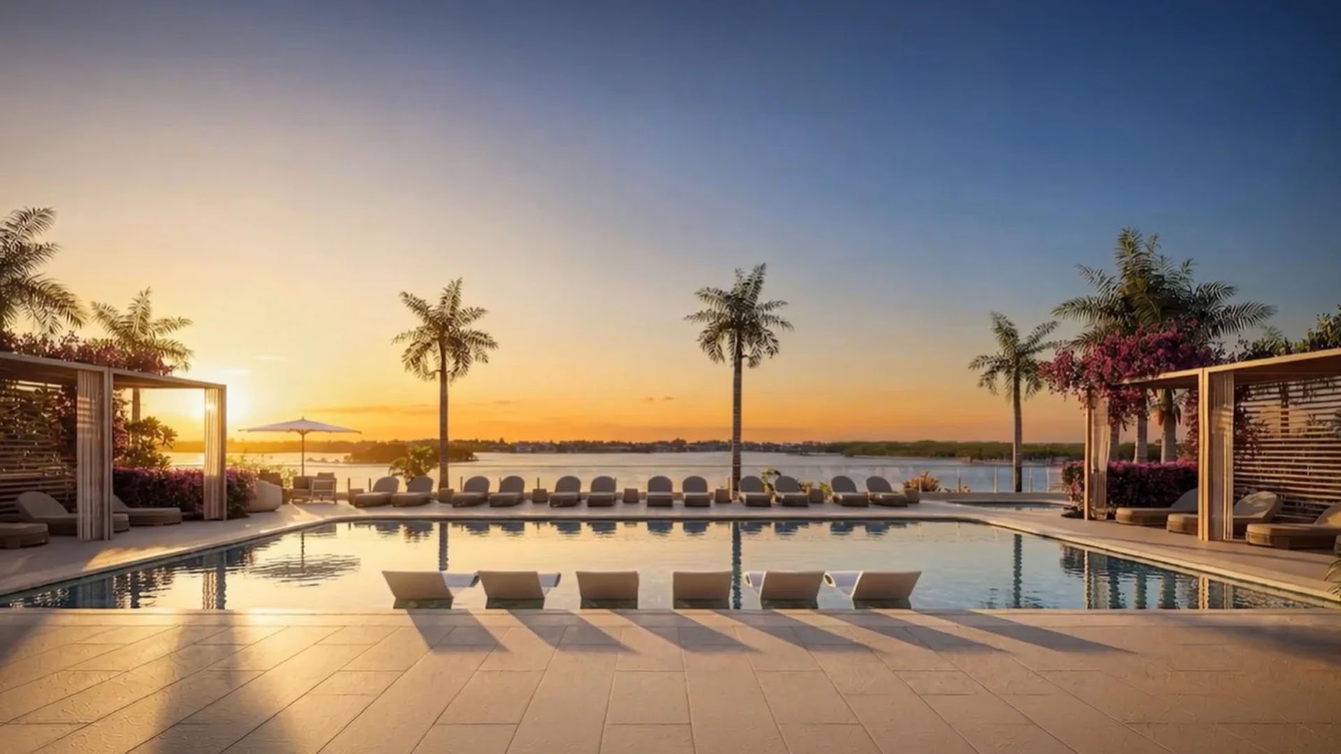 Golden-hour waterfront pool terrace with submerged loungers and palm silhouettes at Maison D'Or in West Palm Beach, capturing luxury and ultra luxury preconstruction condos with resort-style outdoor amenities.