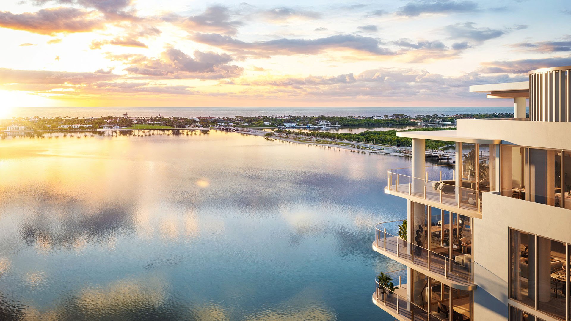 Golden-hour waterfront vista framed by corner balconies at Maison D'Or in West Palm Beach, highlighting luxury and ultra luxury preconstruction condos with panoramic water and horizon views.