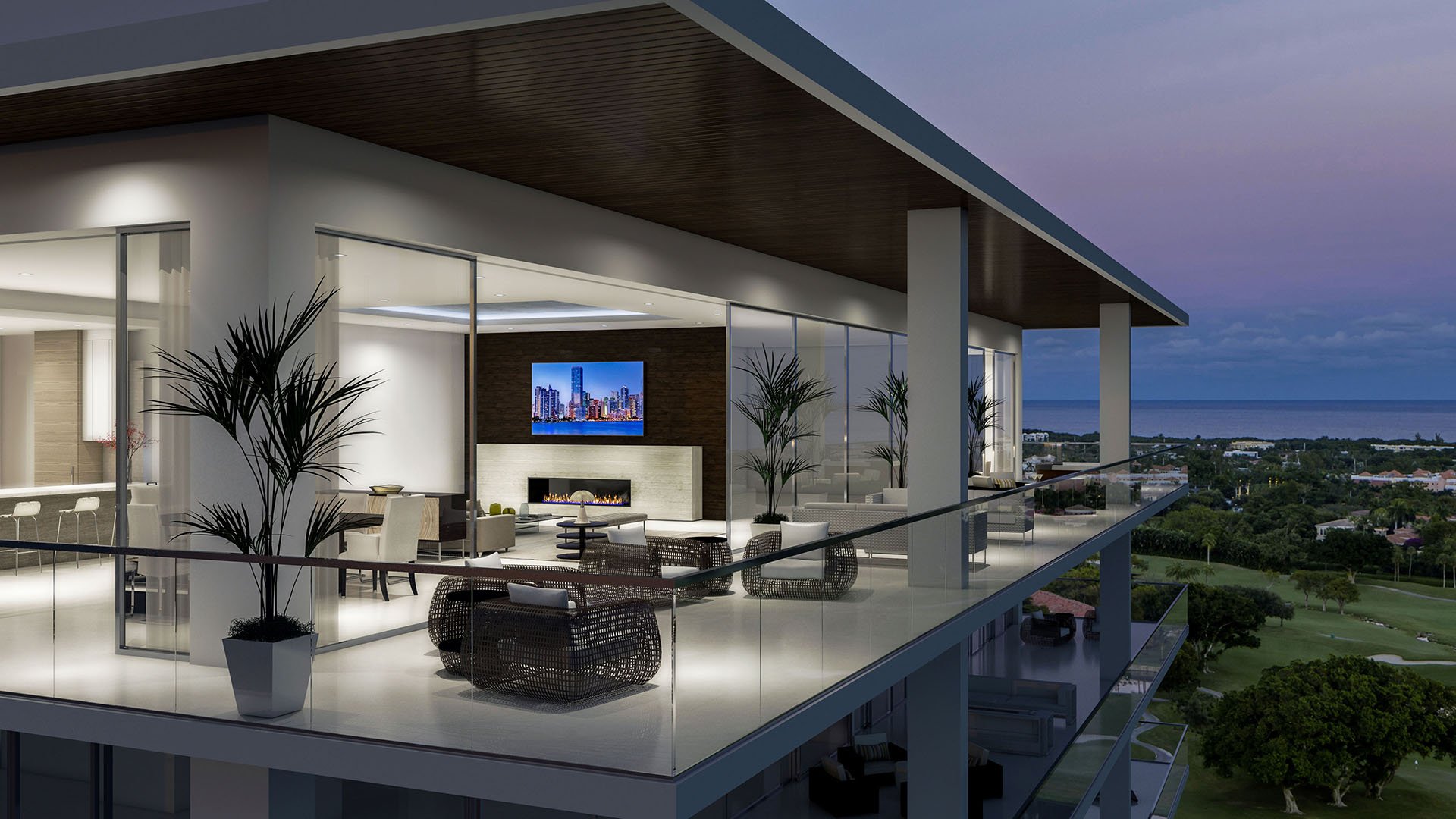 Mandarin Oriental Residences Boca Raton, Florida penthouse terrace lounge with indoor-outdoor seating, modern fireplace and glass railing overlooking the ocean at twilight, highlighting luxury and ultra luxury preconstruction condos.