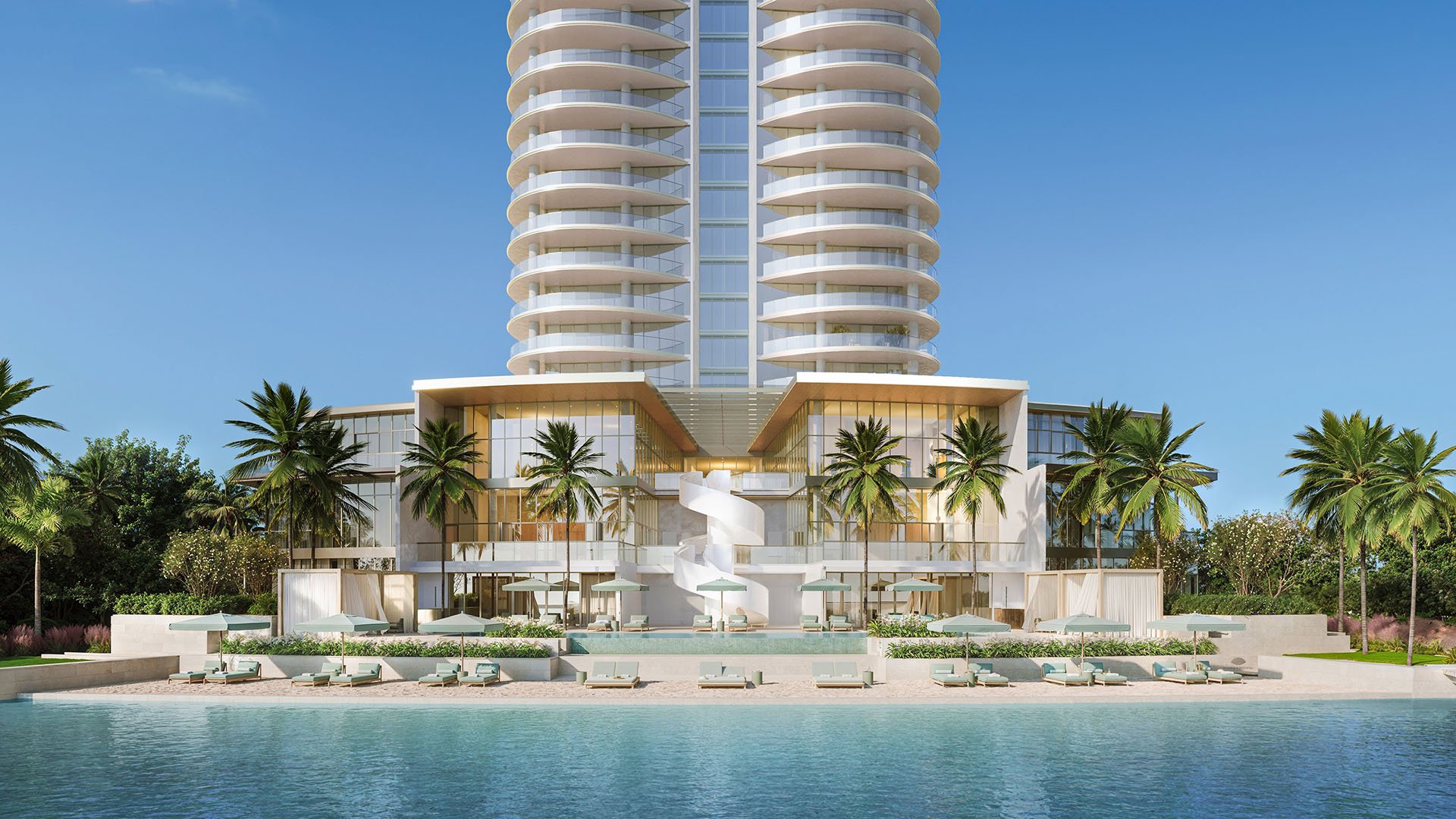 Front view of the waterfront podium with palm trees, cabanas, a pool terrace, and a sculptural spiral stair at Mandarin Oriental Residences, West Palm Beach, ultra luxury condos in West Palm Beach with a luxury amenity deck.