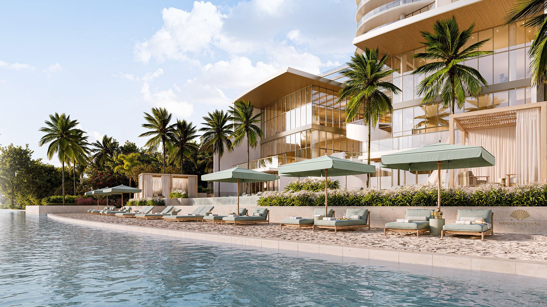 Angled view of the waterfront pool terrace with daybeds, umbrellas, palms, and a glass facade at Mandarin Oriental Residences, West Palm Beach, ultra luxury condos in West Palm Beach with a luxury resort-style deck.