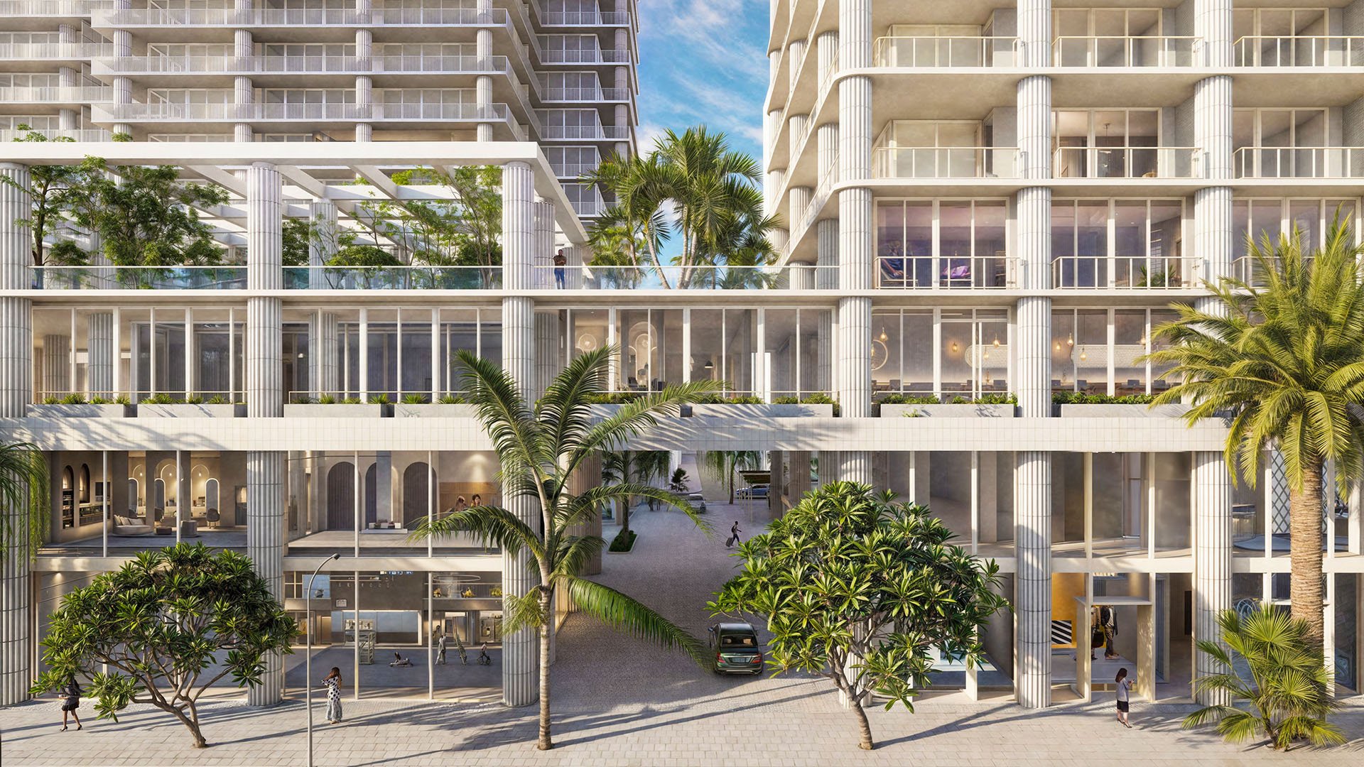 Preconstruction Miami Design Residences in Miami Design District, luxury and ultra luxury condos with a street-level podium, colonnade facade, palms and a central driveway.
