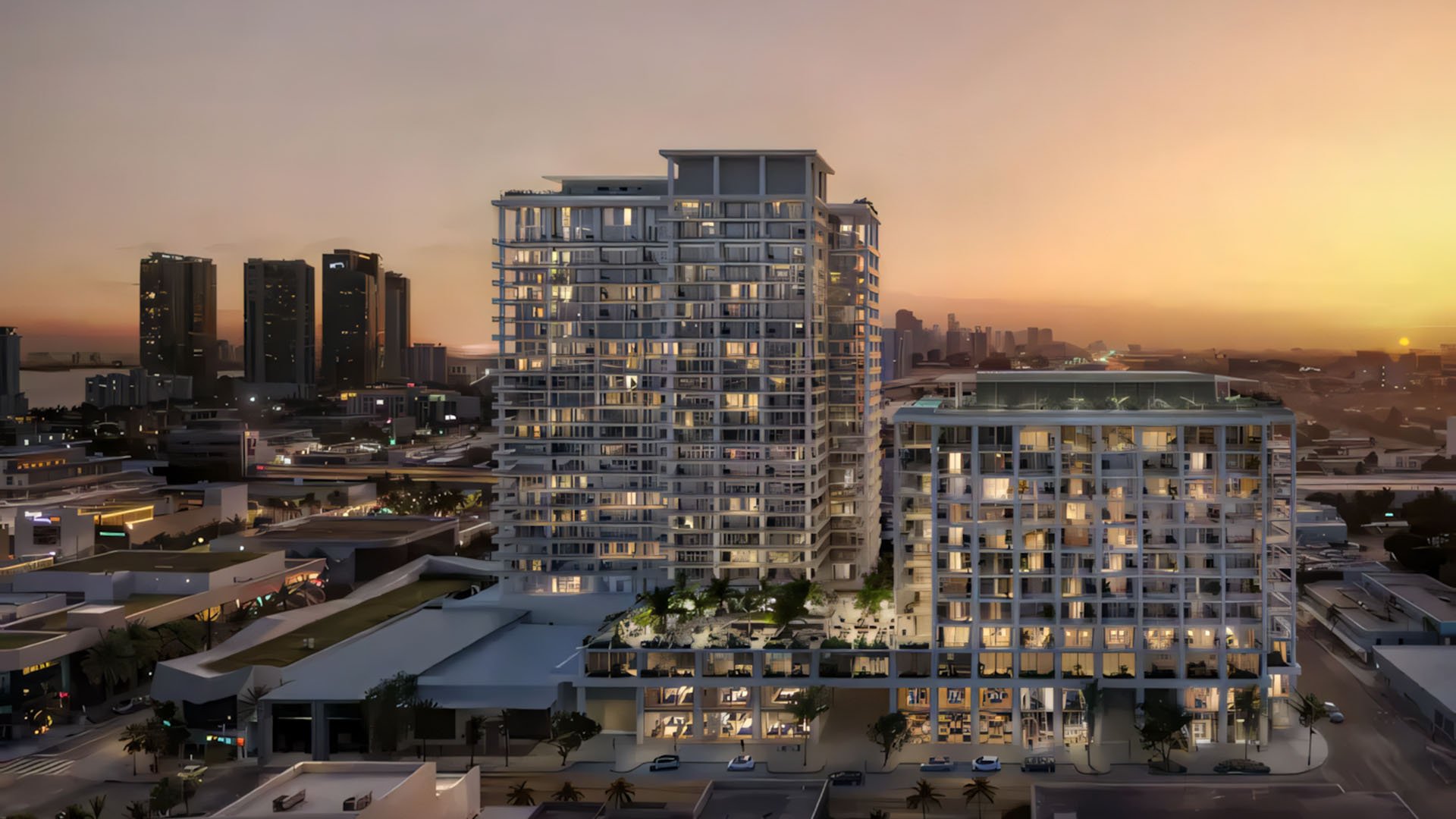 Preconstruction Miami Design Residences in Miami Design District, luxury and ultra luxury condos with a twilight tower and podium skyline view glowing at sunset.