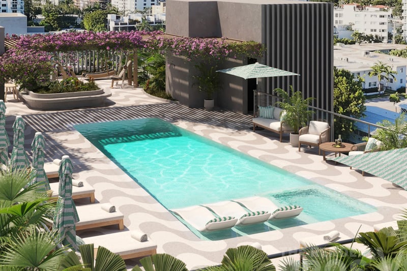 Mila Bay Harbor Islands preconstruction luxury and ultra luxury condos in Bay Harbor Islands with an aerial rooftop pool view, striped loungers, tropical landscaping, and a bougainvillea pergola above the terrace.