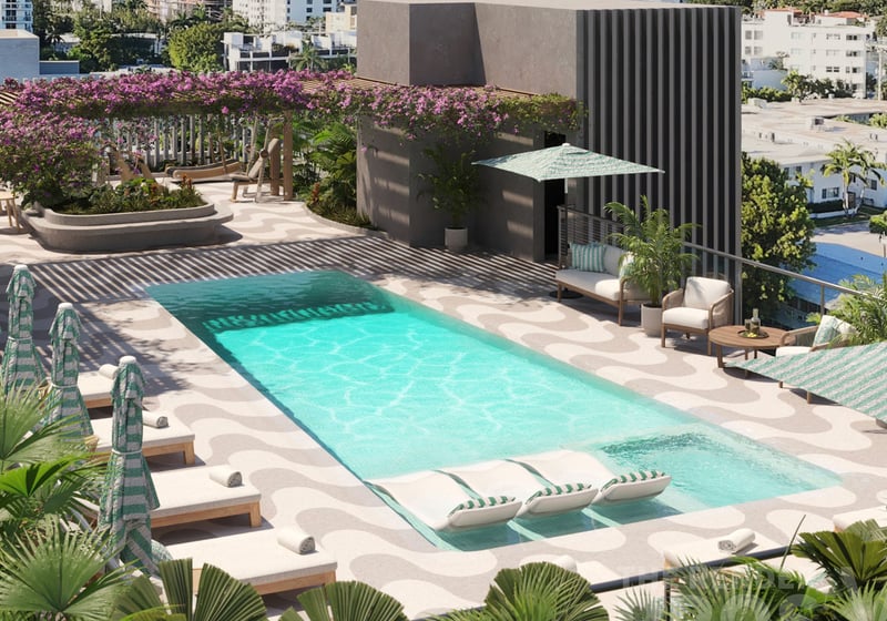Mila Bay Harbor Islands preconstruction luxury and ultra luxury condos in Bay Harbor Islands with an aerial rooftop pool view, striped loungers, tropical landscaping, and a bougainvillea pergola above the terrace.